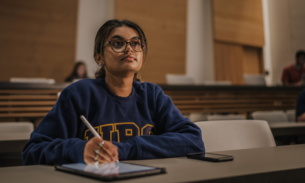 A student sitting in a classroom.